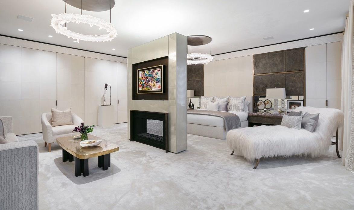 A large bedroom with white furniture