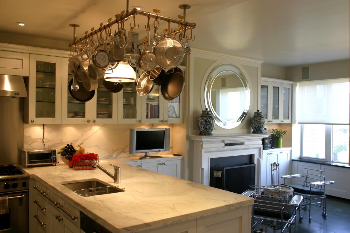 A kitchen with white marble countertops